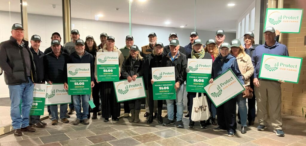 Protec Our Farms members gather at council chambers on 19 August